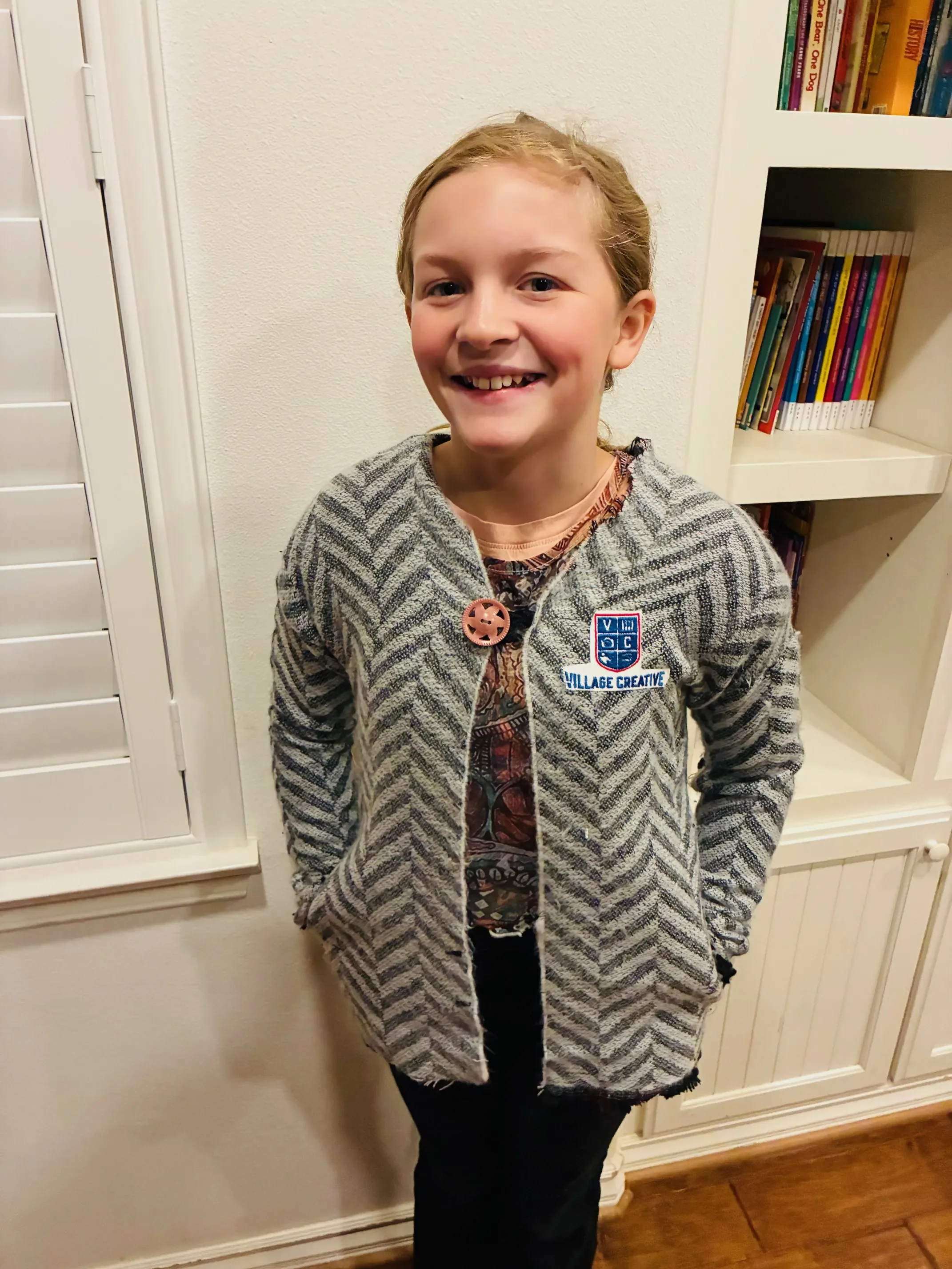 Evie in her blanket jacket with Village Creative patch