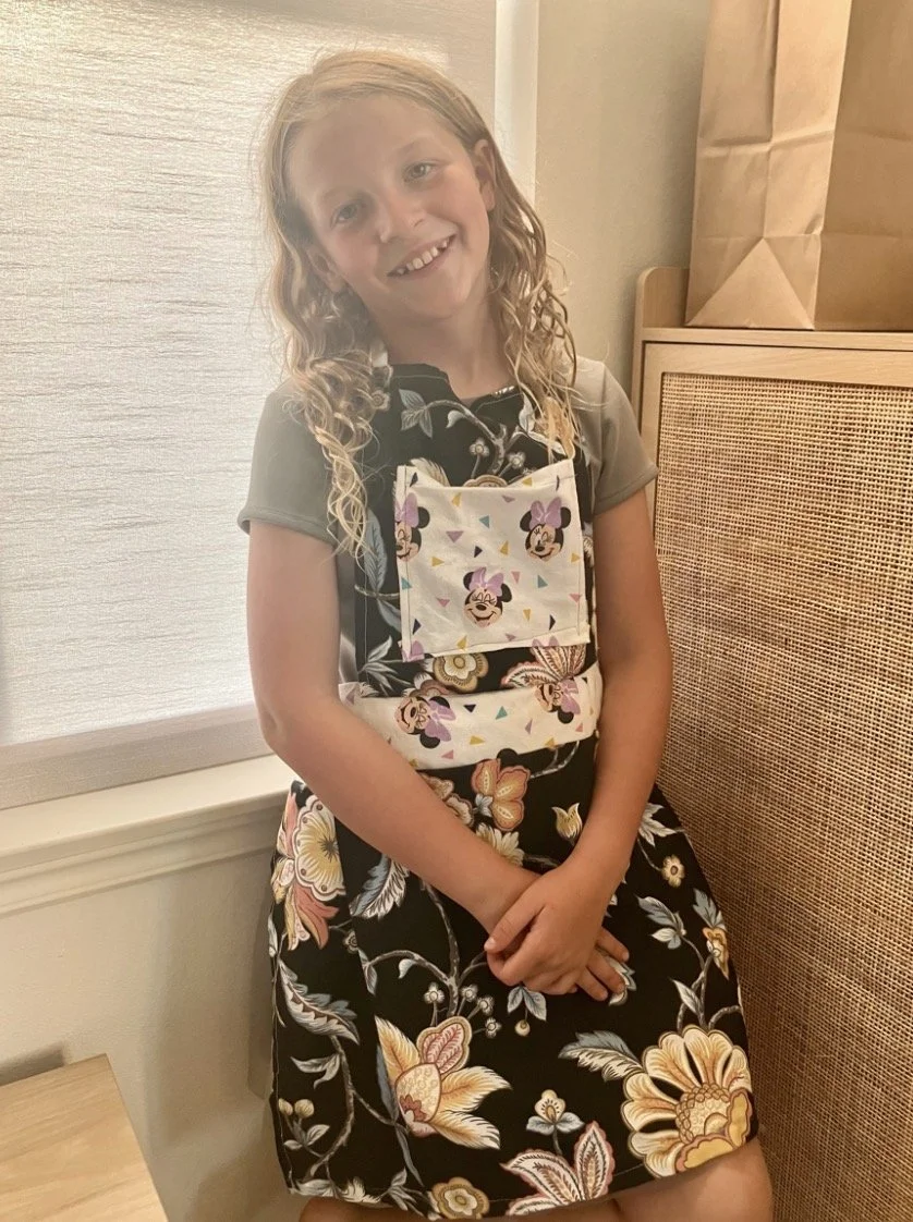 Evie in her handmade apron