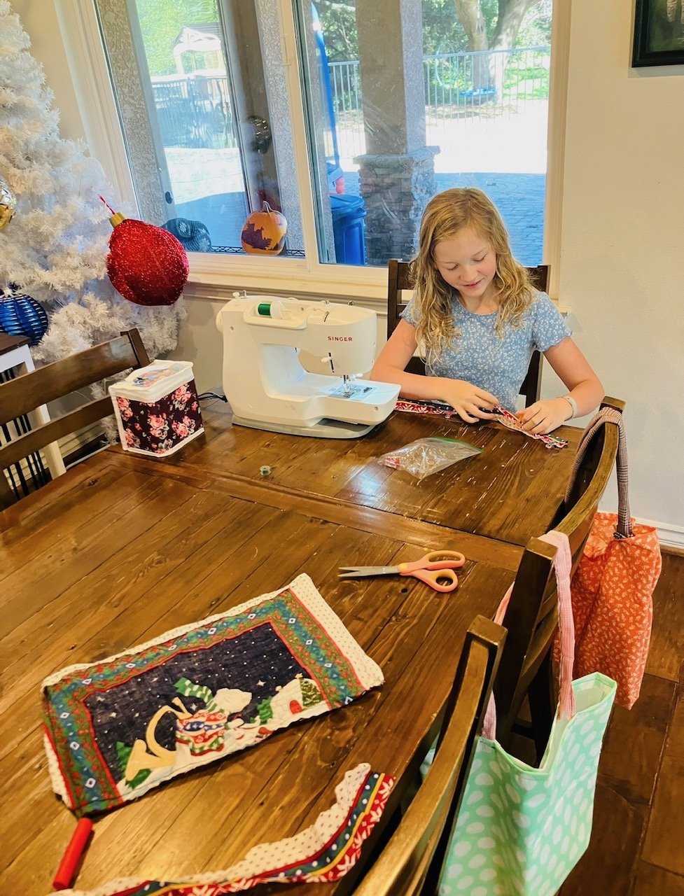 Evie at the sewing machine