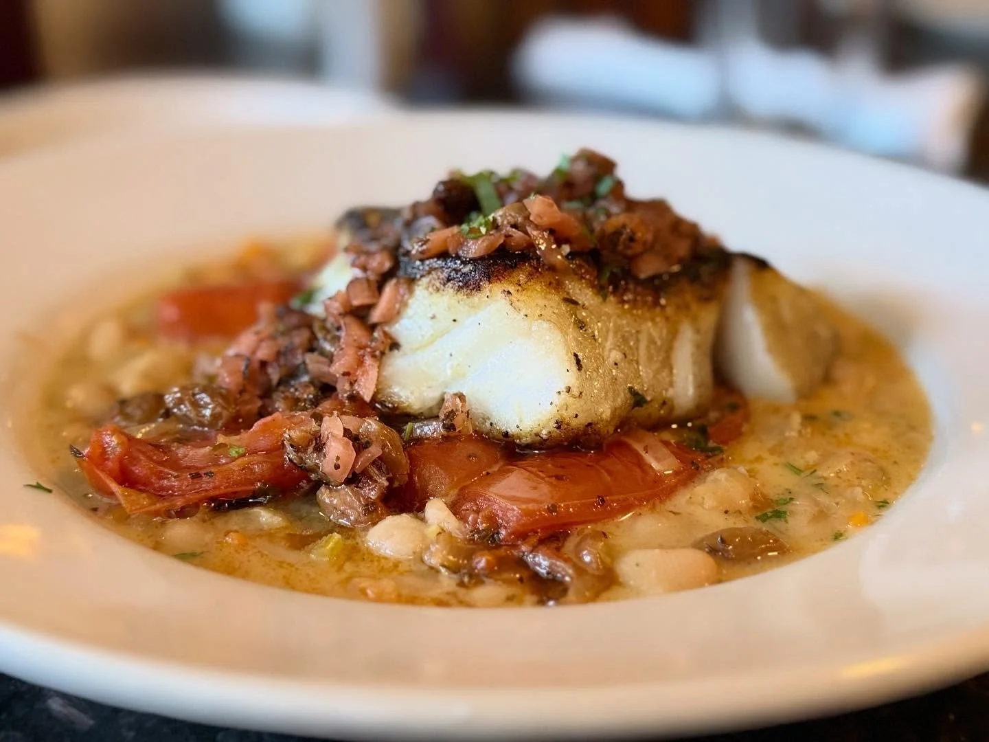 Pan seared cod, braised white beans and roasted tomatoes, raisin agrodolce&hellip;.
#maine 
#seafood 
#camdenmaine