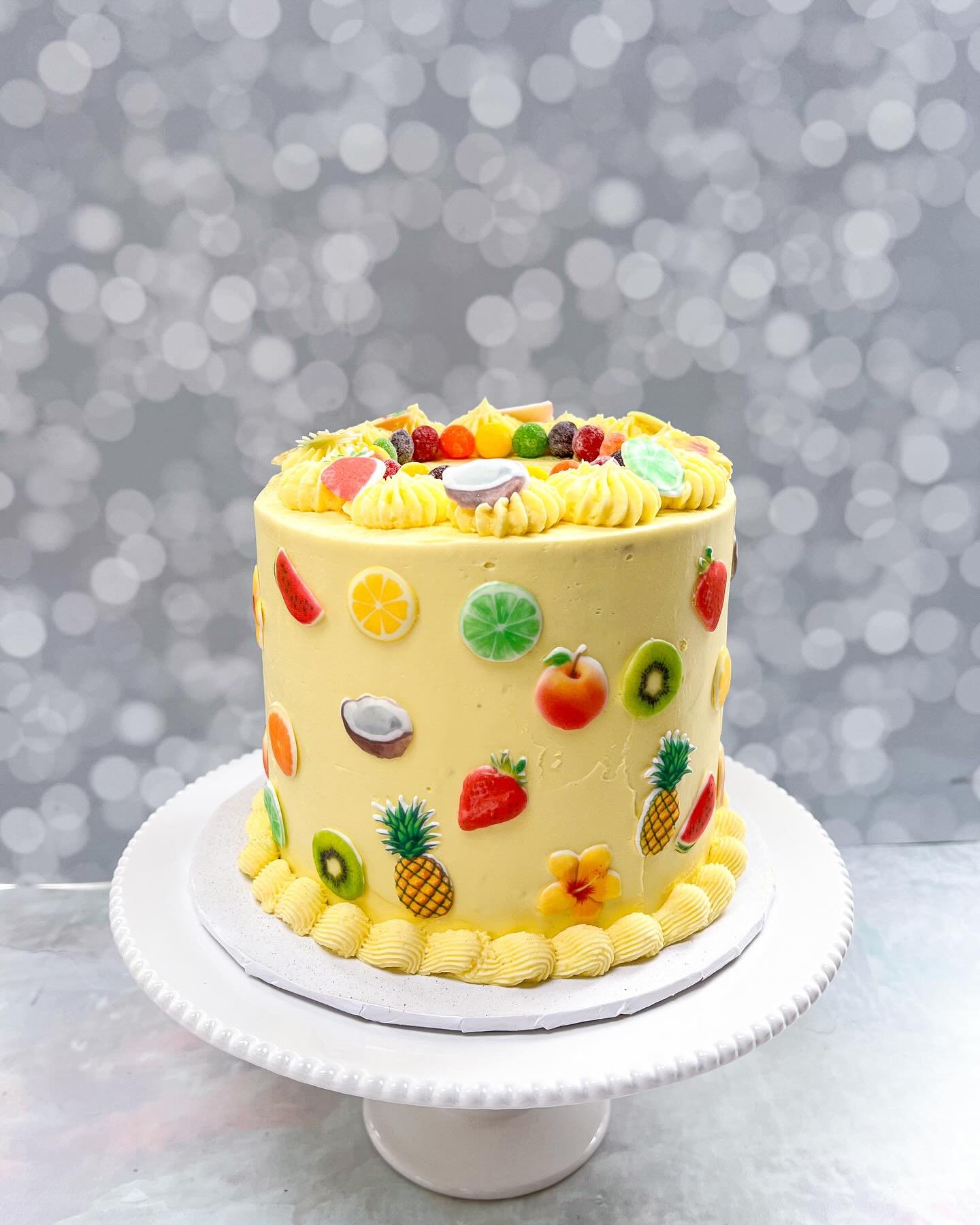 🍋 🍋&zwj;🟩 🍊 🍍 🍓 🥝 🥥

Happy 10th Birthday to my oldest kiddo!  She is VERY into themed birthdays, and this year was no exception. 

A fun fruit-themed cake was her request.  I made little fruit royal icing transfers to add around the cake, and