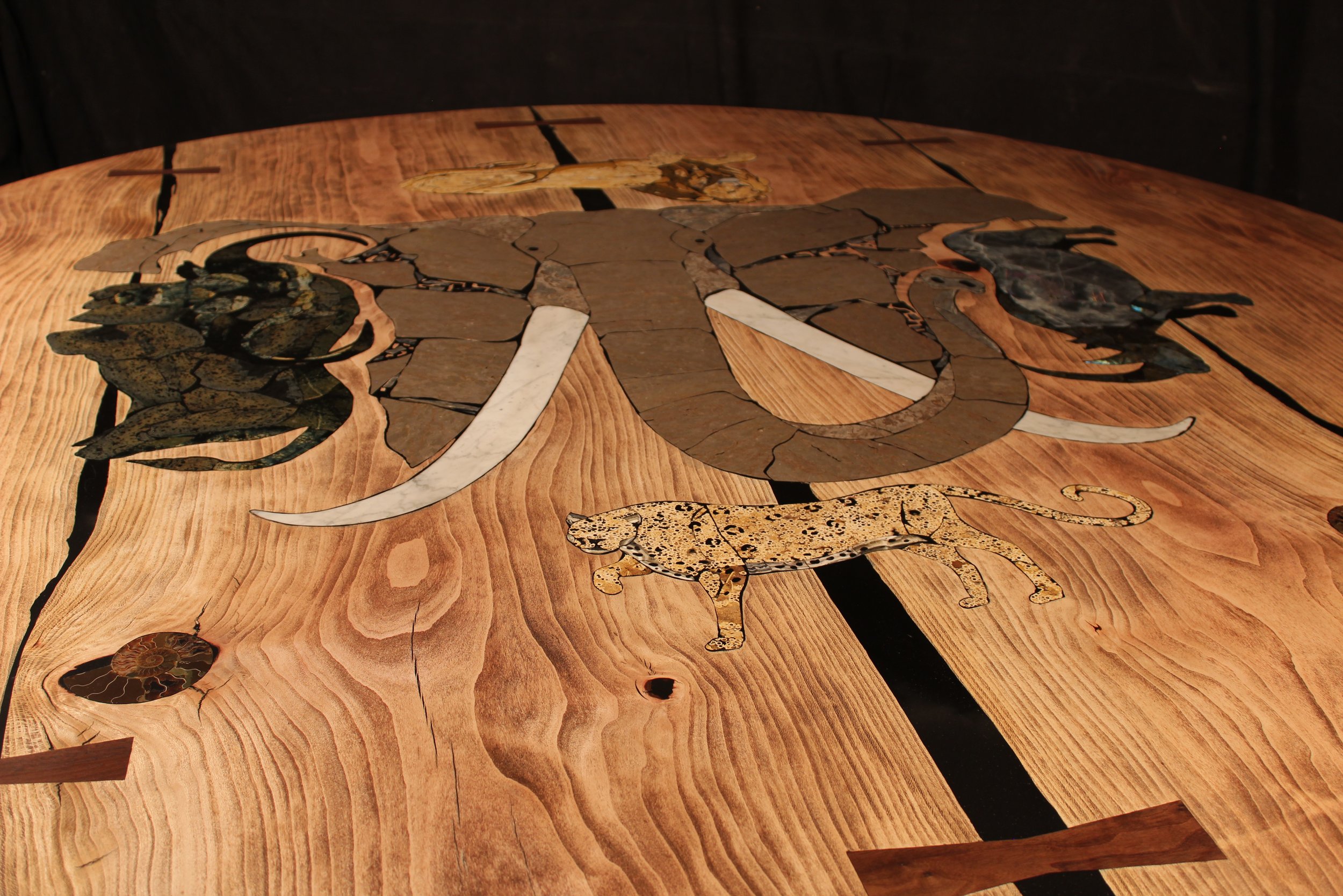 Round table with big five inlay