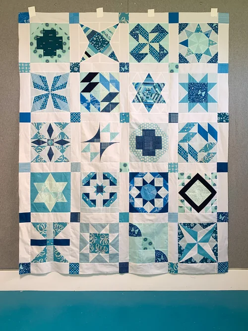 “Summer Sampler” is a Free Sampler Quilt Pattern designed by Katie Clark Blakesley & Lee Heinrich from Swim Bike Quilt!