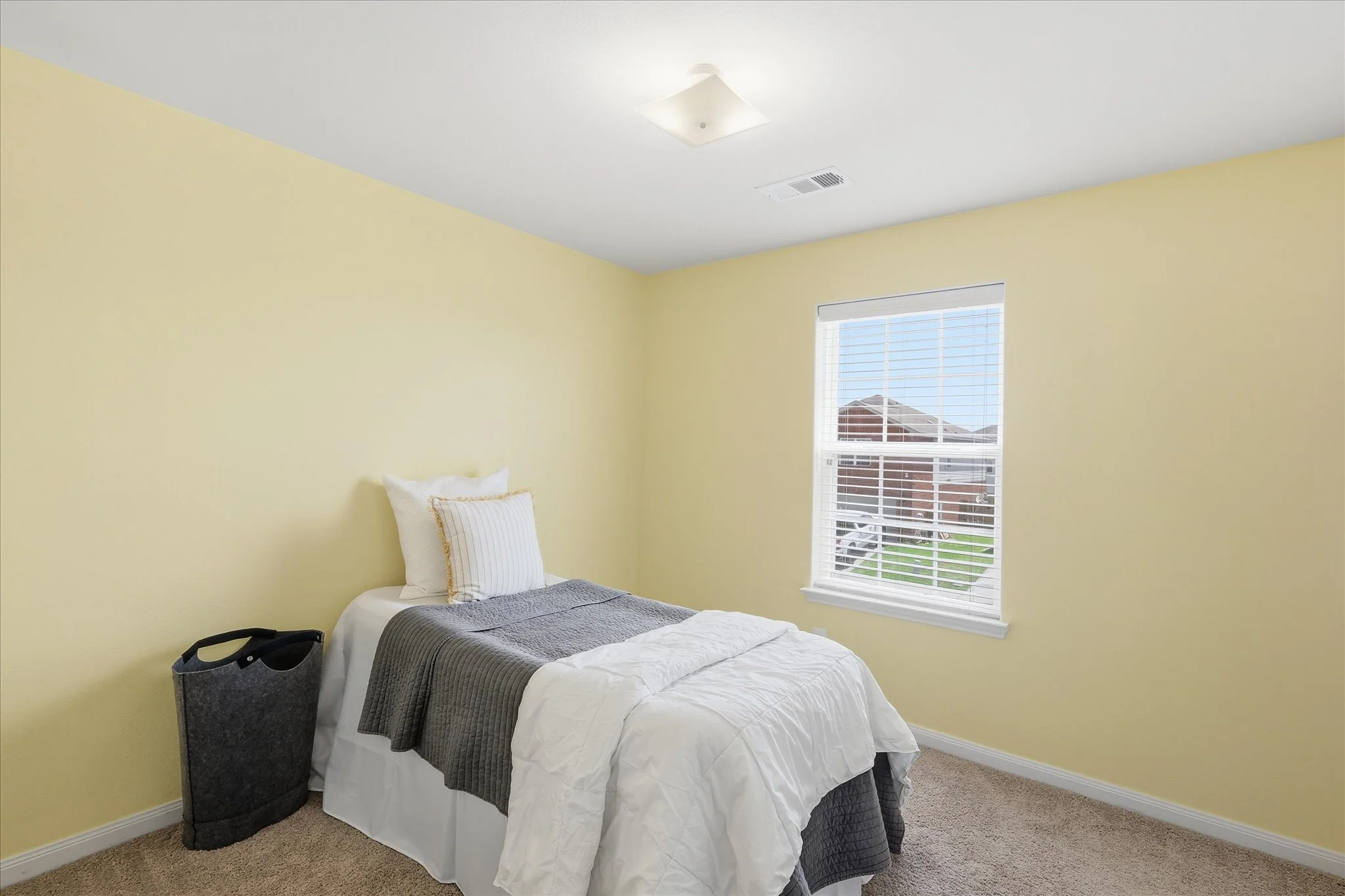 Sunny yellow walls will brighten your day when you wake up.