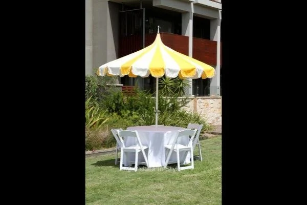 White Folding Chairs with Yellow &amp; White California Umbrella