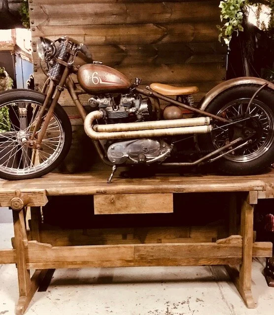 Triumph Motorcycle on workbench