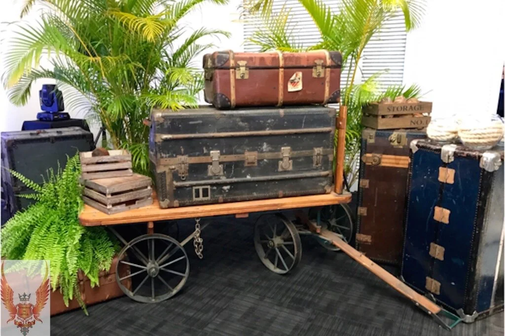 Old Trunks setup on a wooden cart