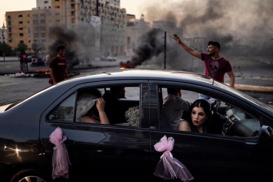  A bridal party traverses the streets of Beirut, Lebanon during a demonstration in the capital on June 26th.   Life in Lebanon is becoming increasingly difficult for the population, with soaring inflation and many families having difficulties of putt