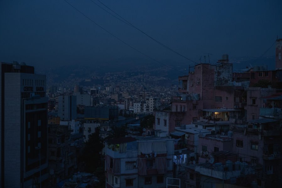  Darkness descends on the capital of Lebanon, Beirut, in July. During the summer, the whole national power grid came down, and only the few ones that had private generators - and money for diesel - were able to have lights in their home. 