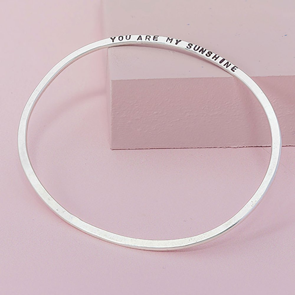 Side Stamped Oval Sterling Silver Bangle by Jordan Lily Designs