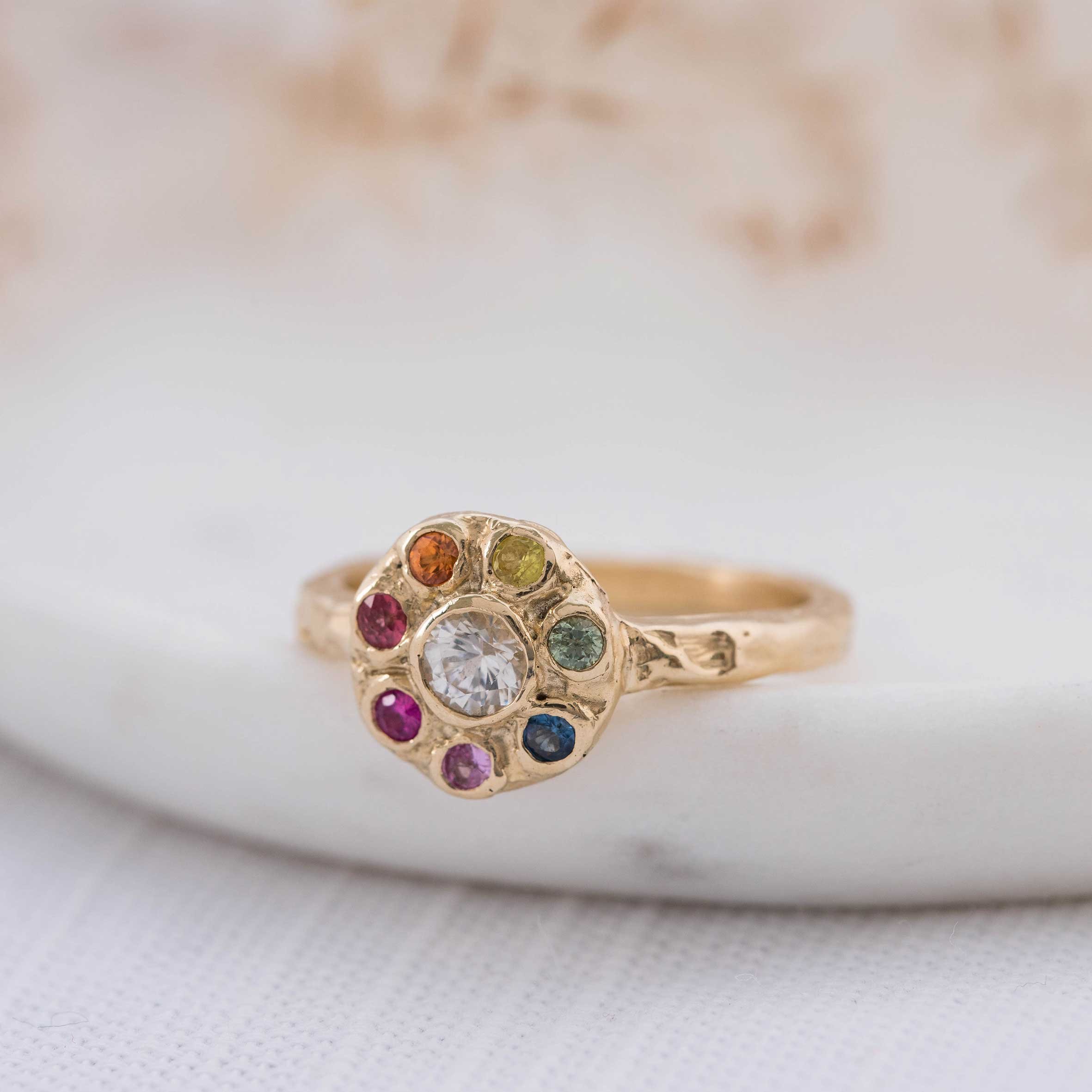 IRIDIANA Rainbow Sapphire Halo Ring by Anvil and Ivy