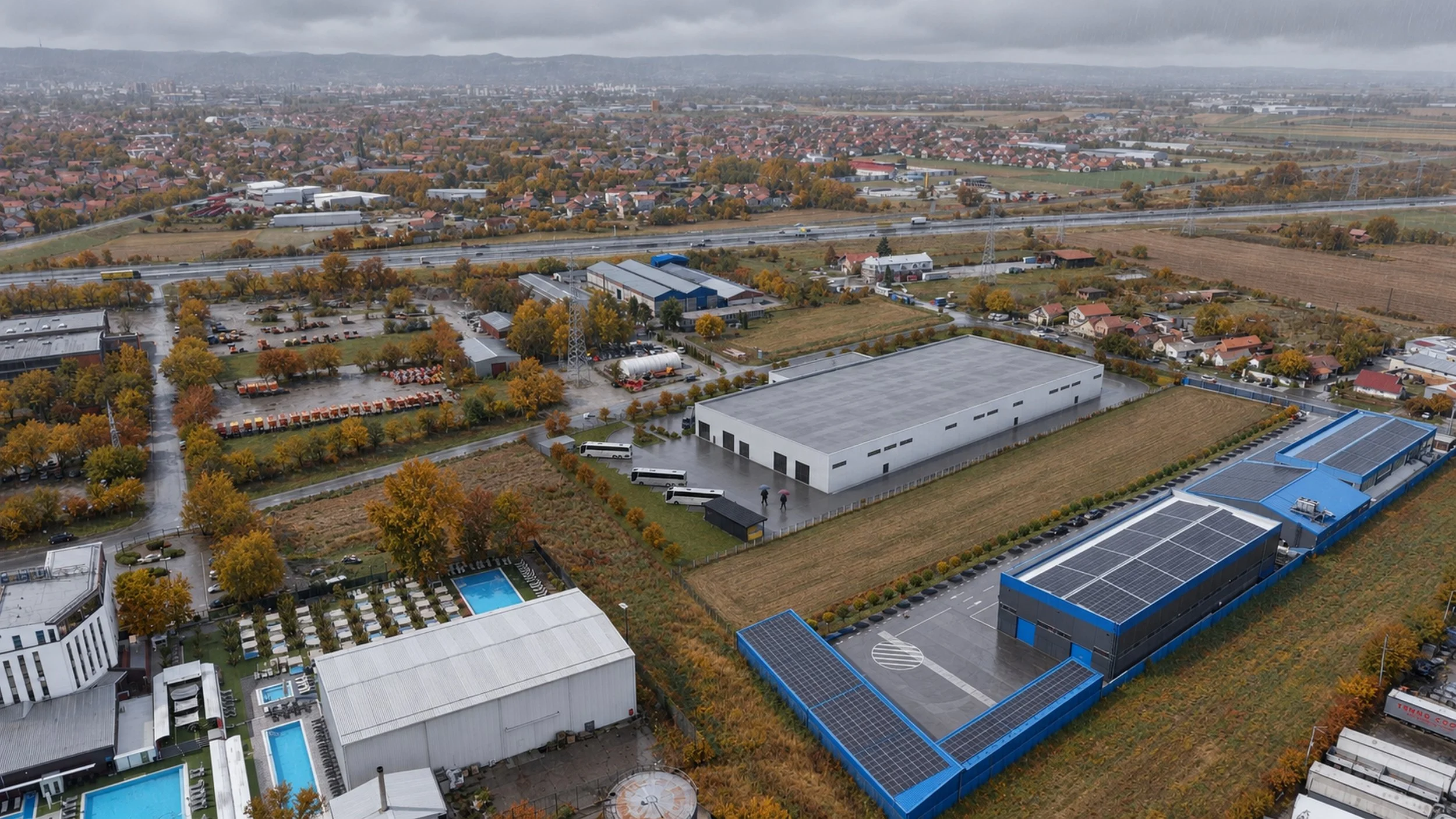 Windy autumn rain over factory aerial.jpg