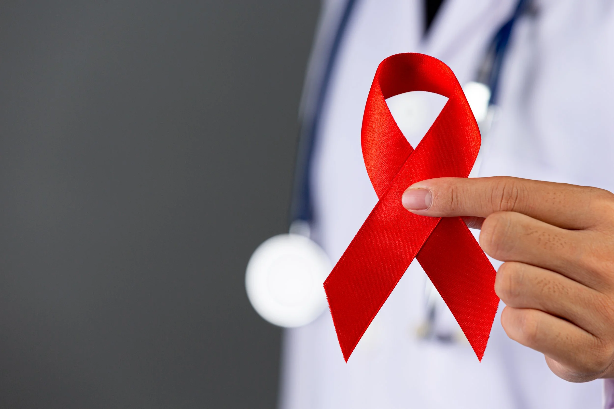 doctor-holds-red-ribbon-hiv-awareness-awareness-world-aids-day-world-sexual-health-day.jpg