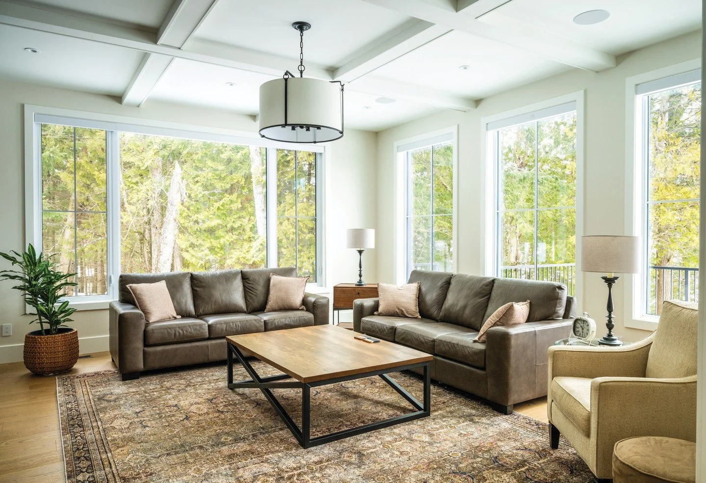 Window walls in the family room of this Port Syndey cottage let light in while providing a direct connection to nature. Coffered ceilings are a sharp, yet stylish architectural. A treasured spot to welcome extended family and friends. See more of thi