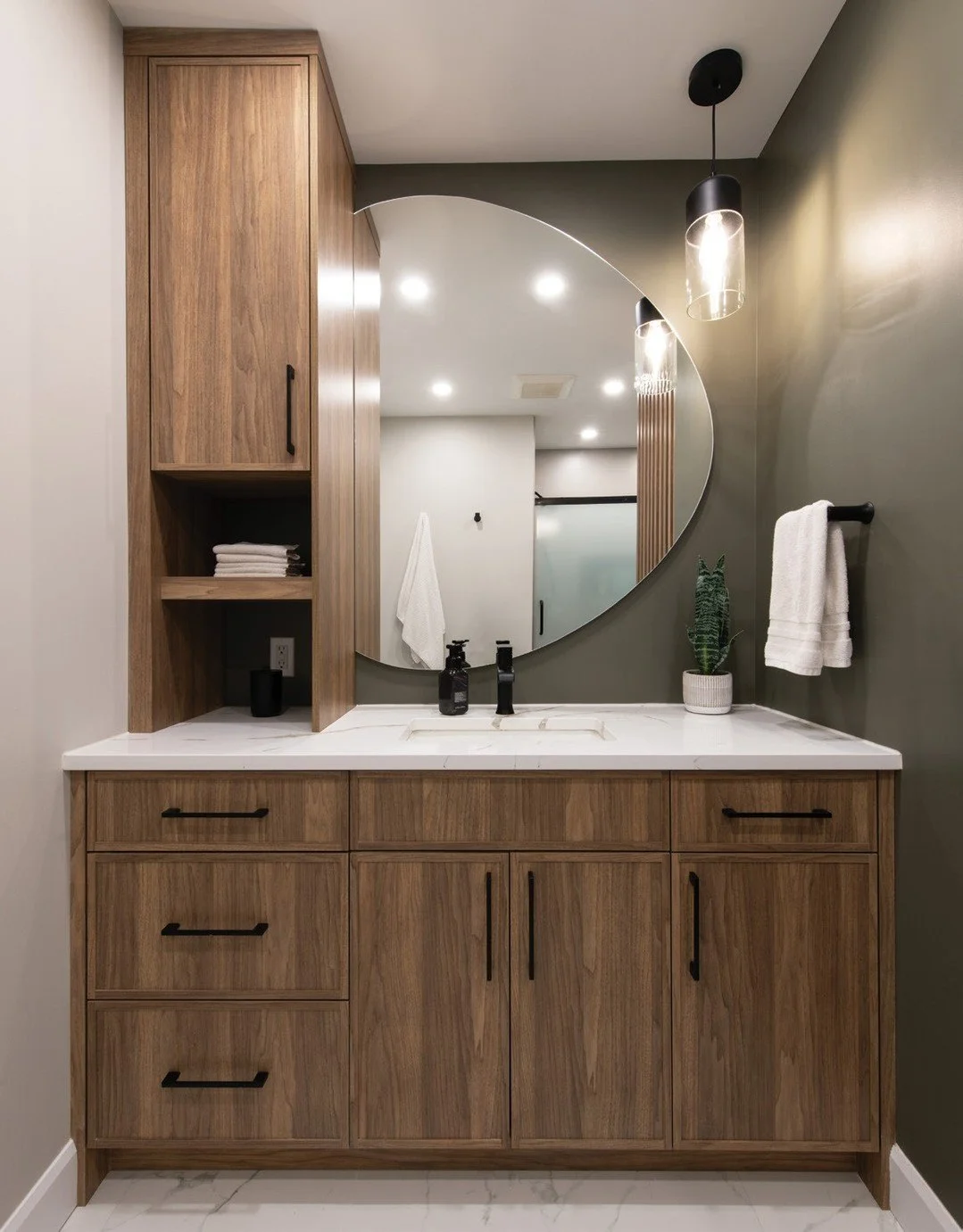 In the Summer issue, we featured this Rockland home renovation that started as a bathroom makeover that quickly blossomed into a full main-floor makeover. Beautiful dark cabinetry and vertical wood slats provide privacy for the water closet, ensuring