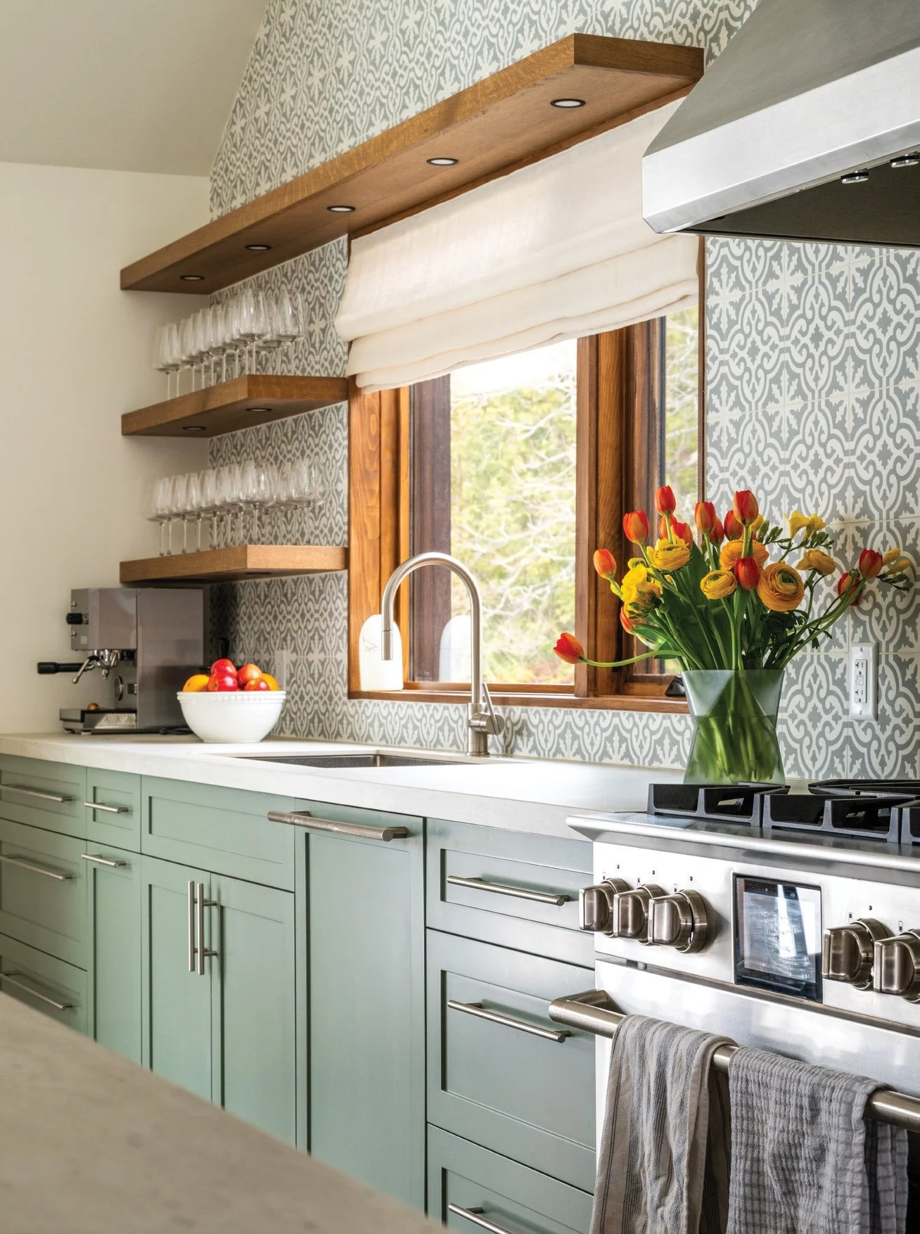 Design Inspiration: Select a decorative patterned tile backsplash that draws the eye up, like this home with a vaulted kitchen wall. Chosen over wallpaper in this Warkworth home, the tile provides a striking look that&rsquo;s both durable and easy to