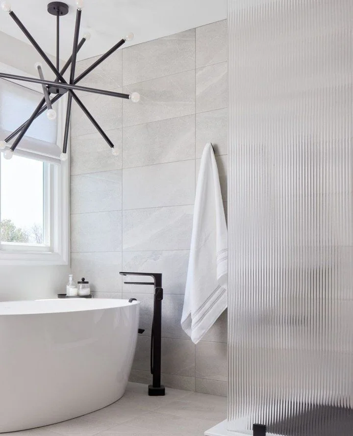 Soft textiles, muted tones and restrained styling transform the primary bedroom into a calming retreat that feels quietly luxurious without excess. Stunning featues include ribbed glass as texture and privacy to the en suite while still allowing natu