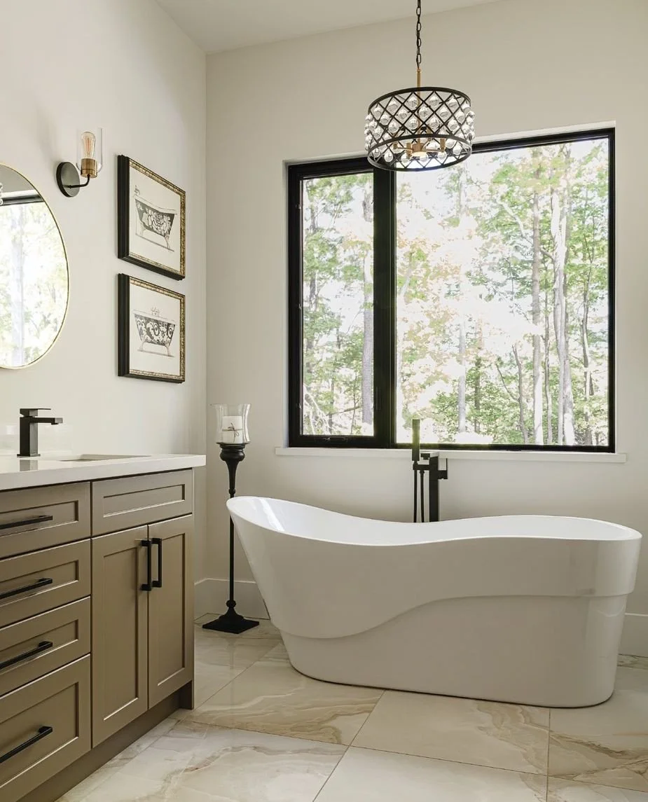 Featured in the latest issue, this newly built home in Grey Highlands is a beautiful home perched on the edge of the escarpment overlooking Georgian Bay. In the primary en suite, the warm tones of a large scale caramel-veined tiles line the floor and