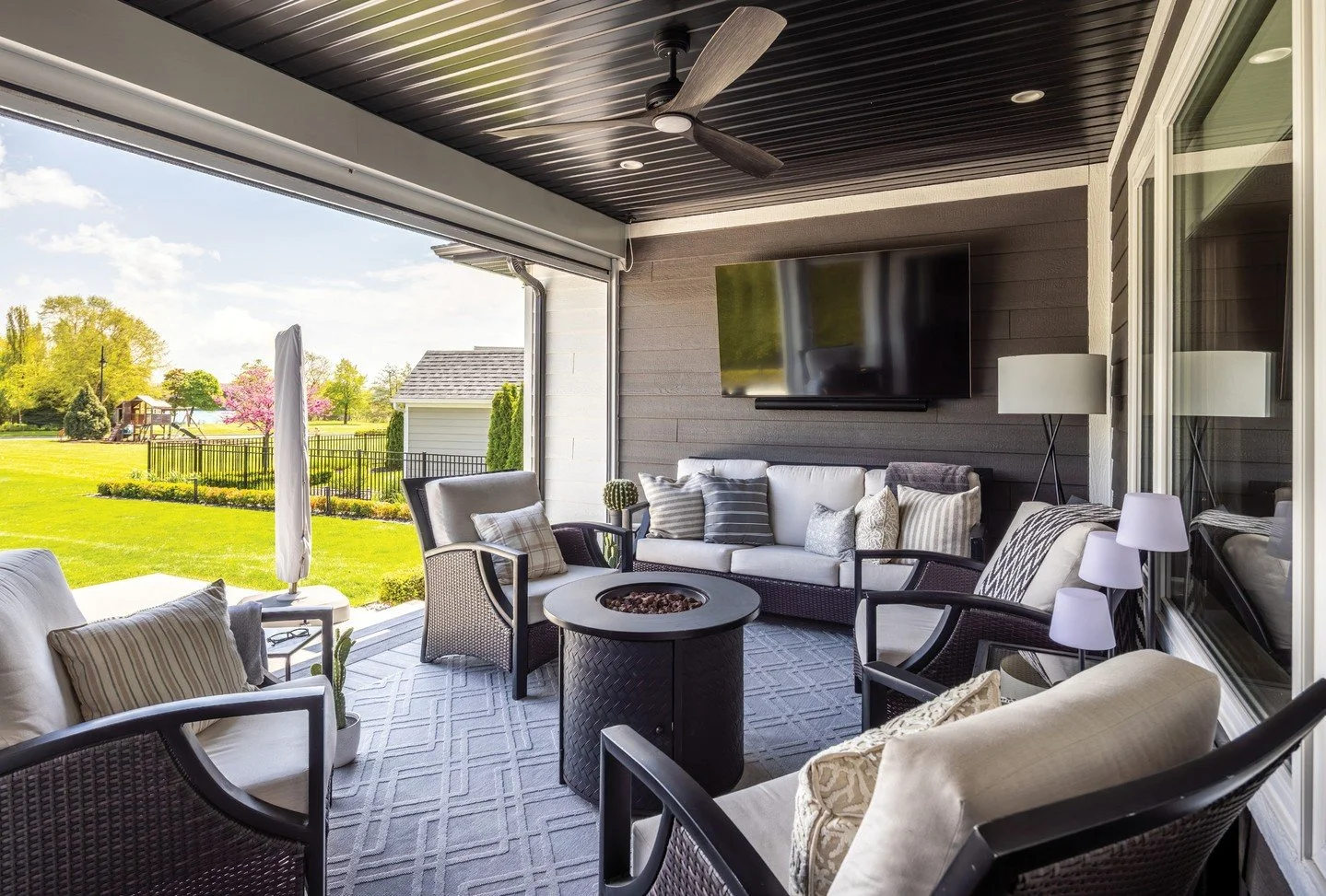 Classic coastal architecture and crisp dark accents bring timeless curb appeal to this gorgeous Bois Blanc Island home. The vibe is casual, inside and out. The backyard  features a manicured green space with the river just beyond. There&rsquo;s no be