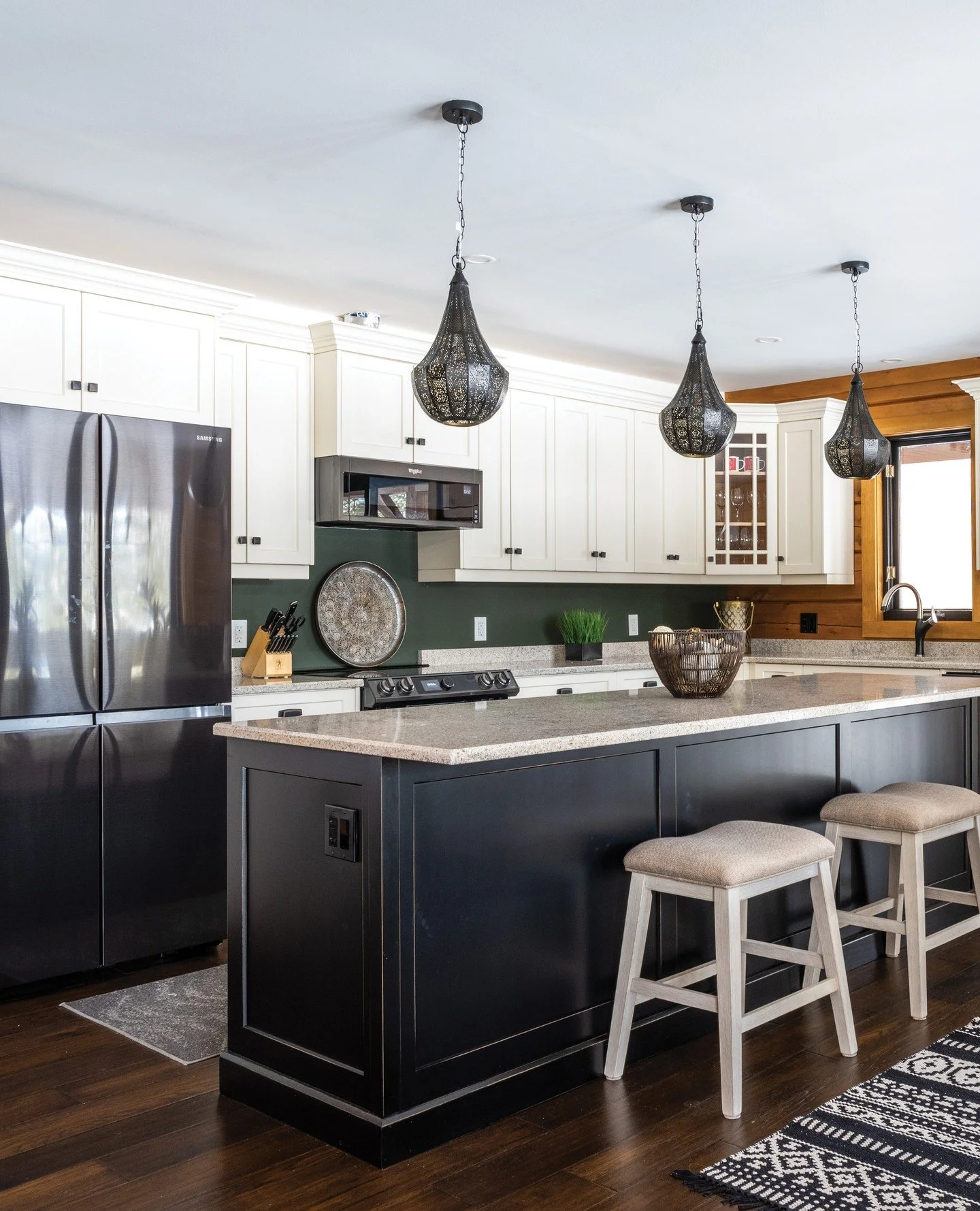 There is nothing quite like stepping into a log home. This lovely home is featured in the Mid-Summer issue and the attention to detail shines. The kitchen embodies a rustic farmhouse appearance and is perfect for entertaining. White Shaker-style cabi