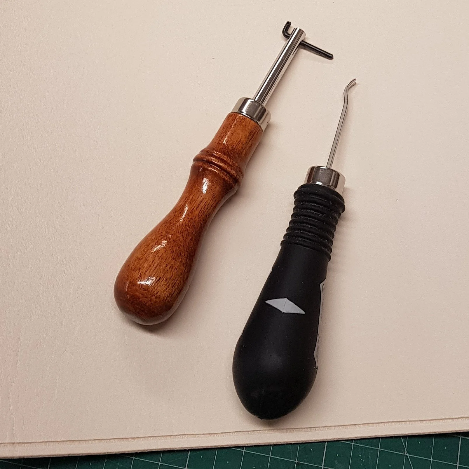 Edge finishing and stitching line tools for leatherworker during preparation of the leather.