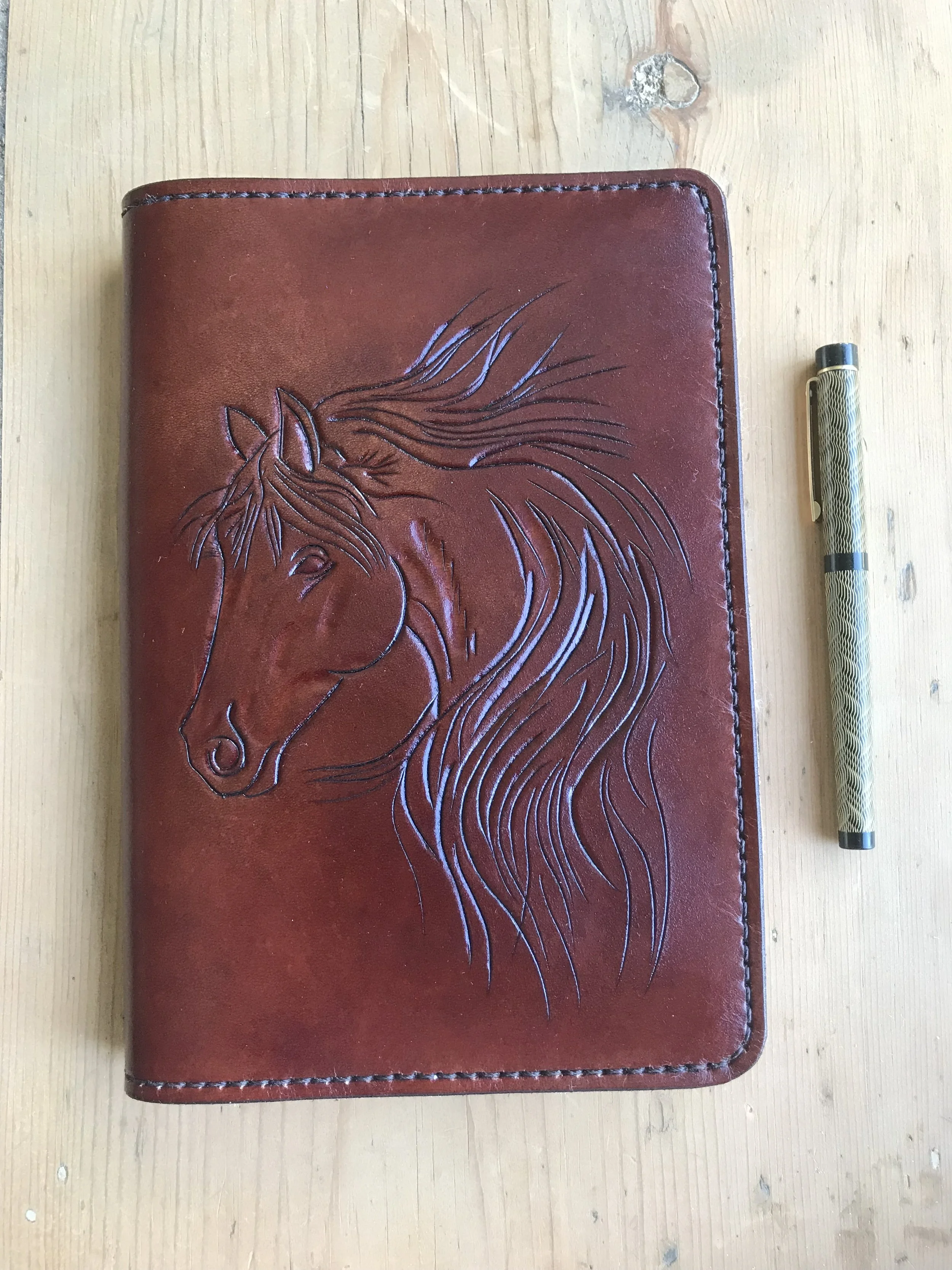 A5 leather refillable journal cover with horse head. Colour Medium Brown