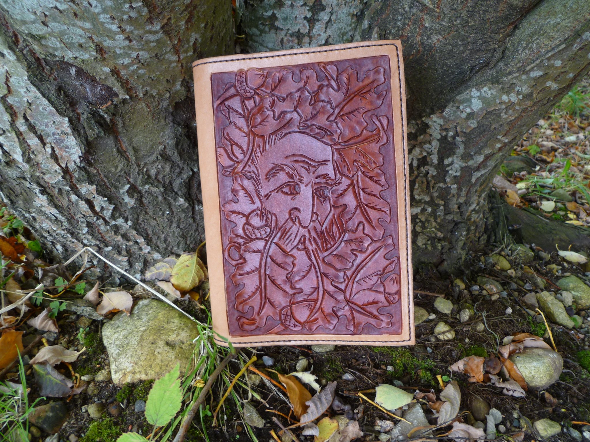 A5 Journal refillable cover featuring tan woodland spirit in oak leaves and with natural leather border