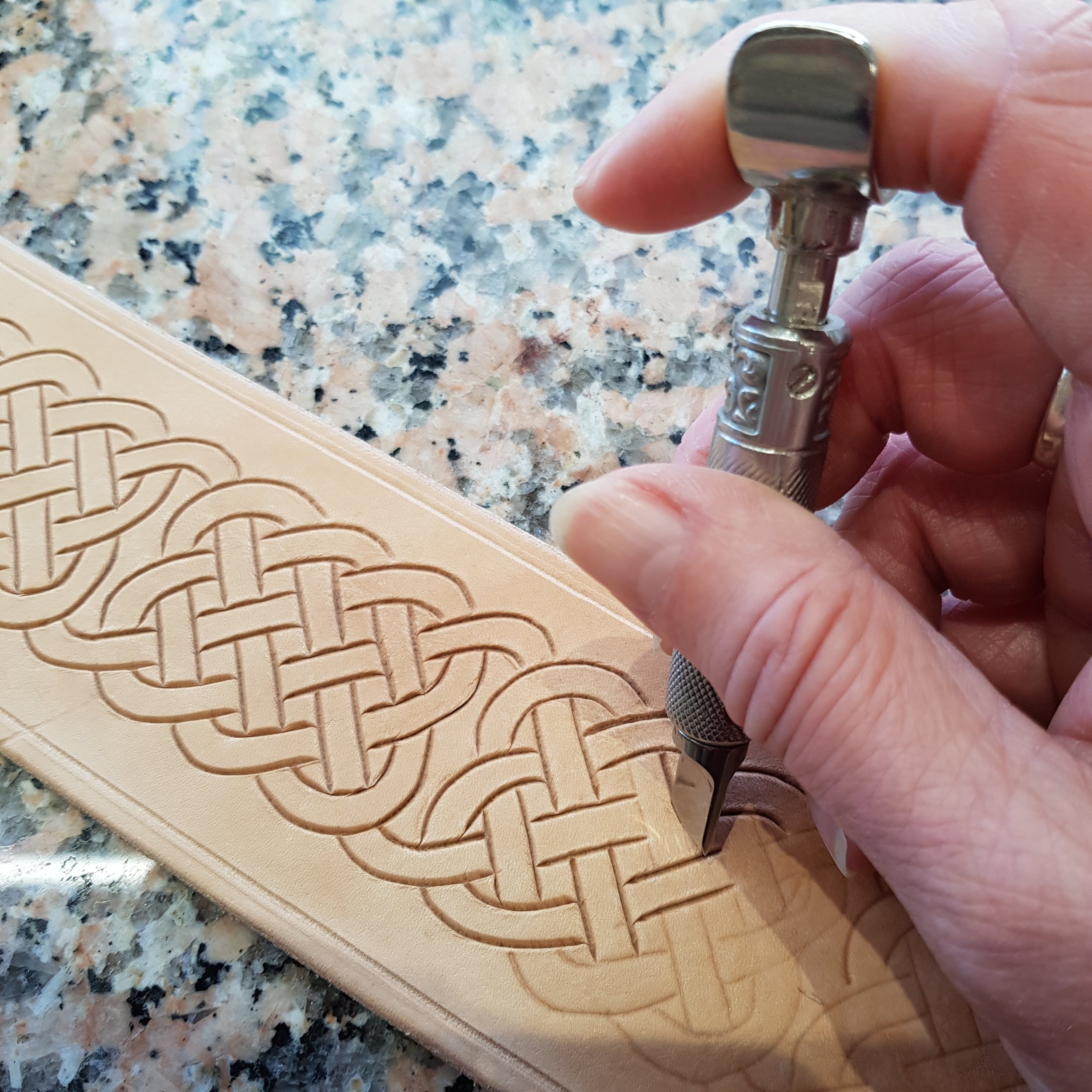 Carving a knot guitart strap.jpg