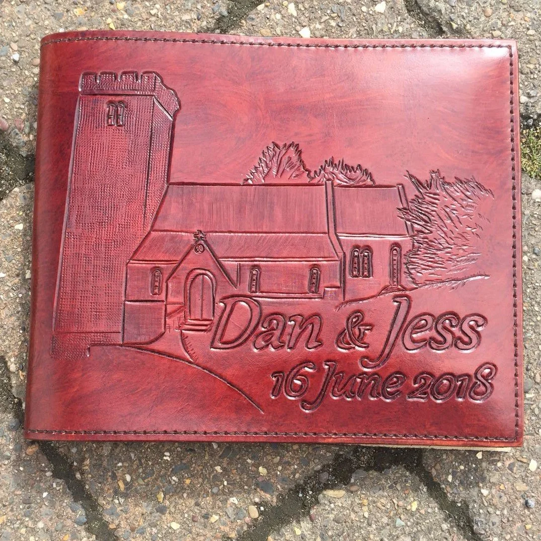 Wedding guest book front cover. A4 Landscape, dark tan with church and text.