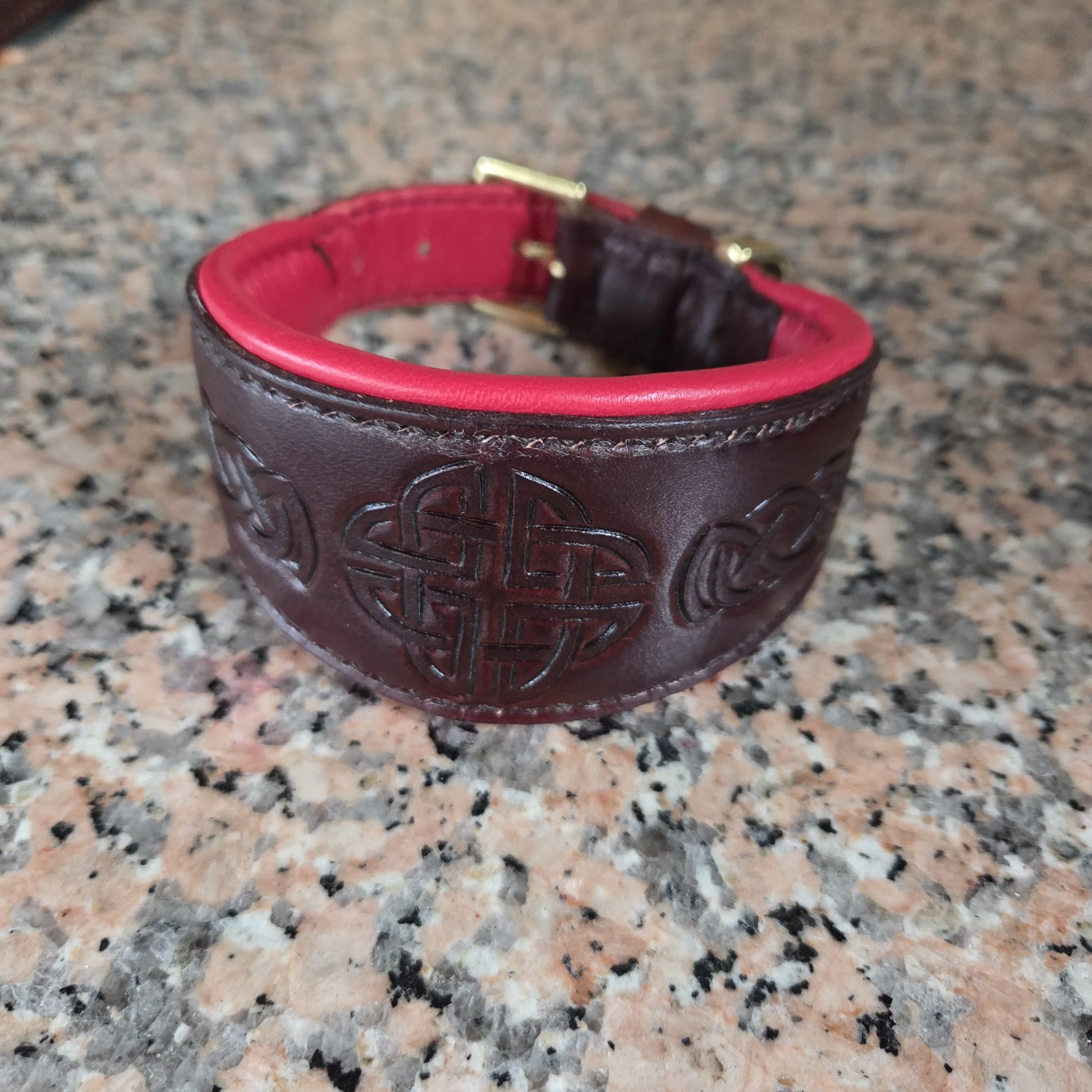 Deerhound Collar 2.jpg Handcrafted leather deerhound collar featuring Celtic knotwork on Bordeaux leather with red padded lining and brass fittings