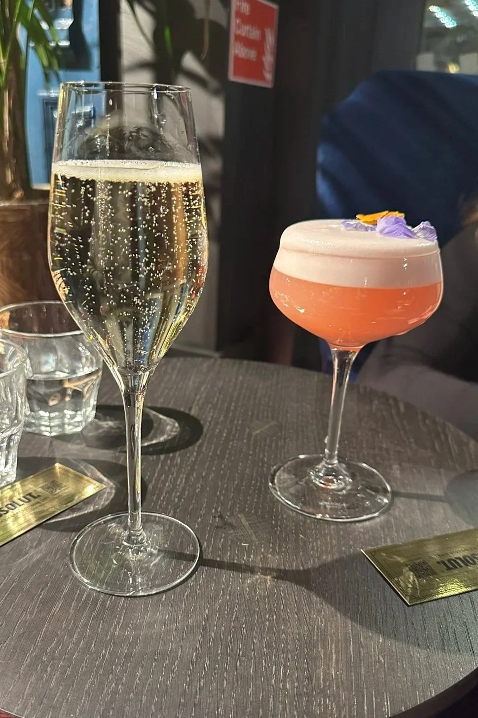 glass of prosecco and Naughty Lucy cocktail at Hotel Stella Ruby Bar in London