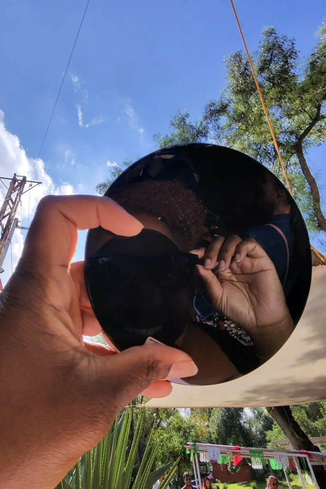 view of the sun through obsidian rock