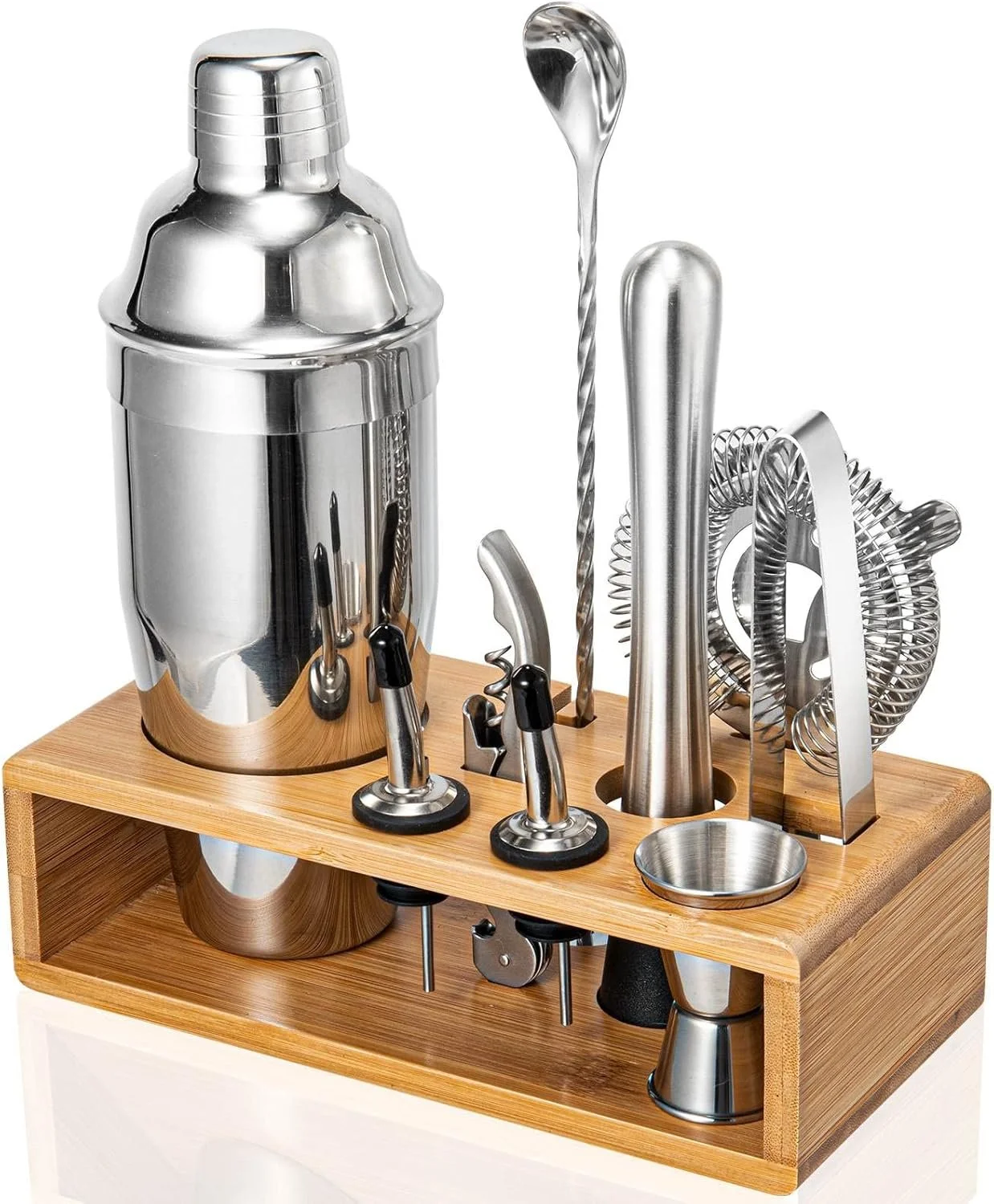 Bartender's cocktail shaker and bar tools on a wooden stand, including a twisted bar spoon, strainer, jigger, and muddler.