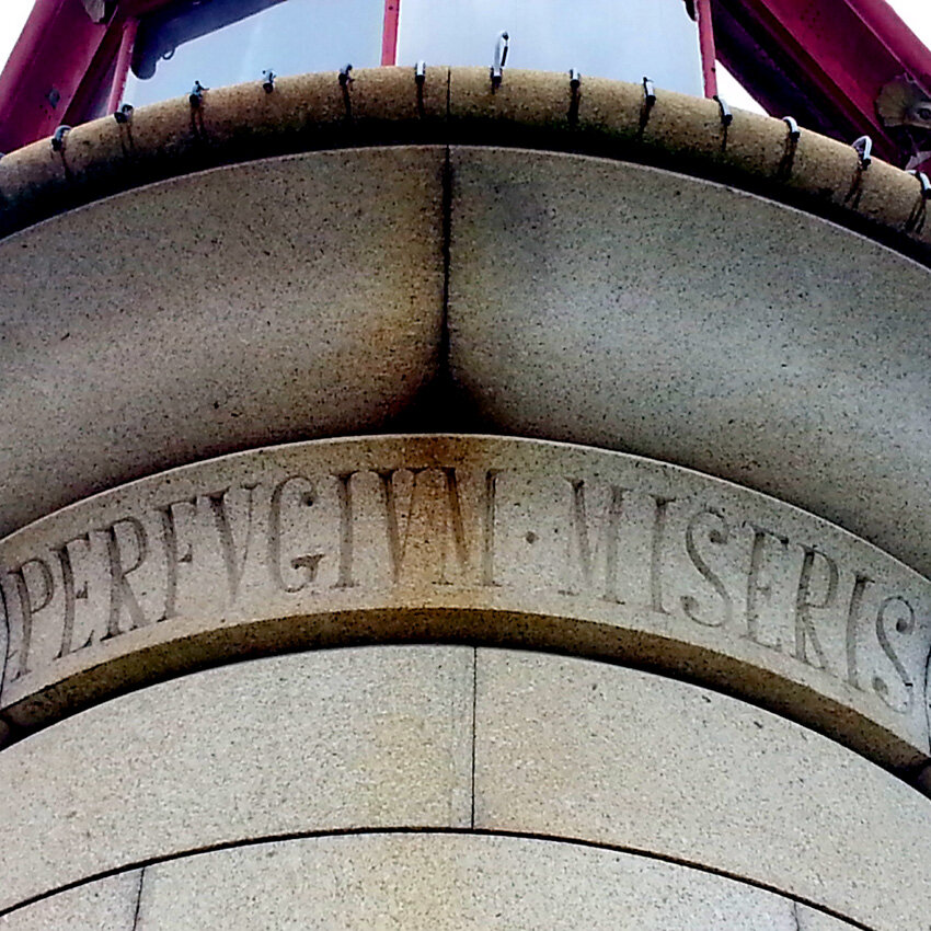 The Latin motto in the lighthouse