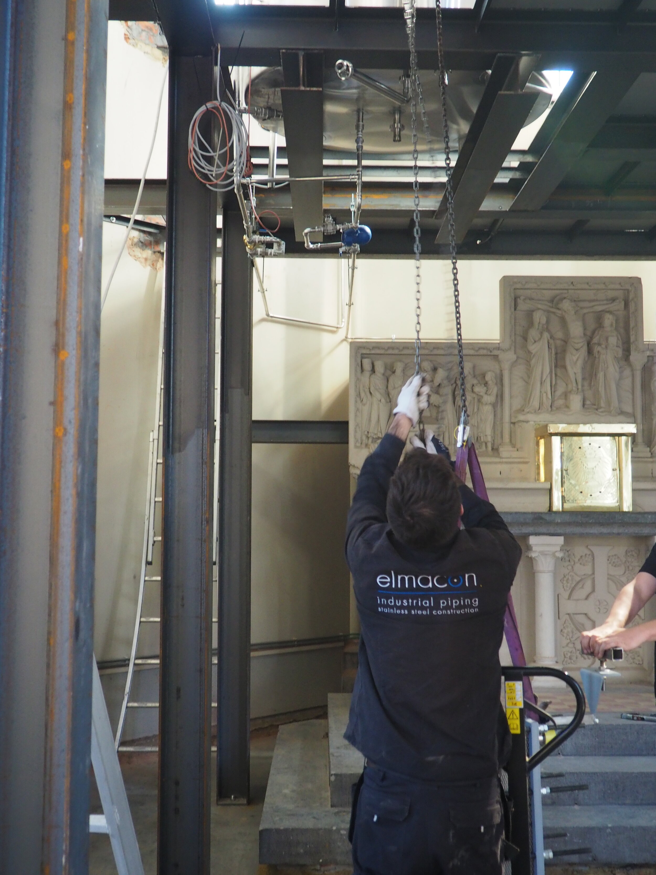 Rui installing the heat exchanger...