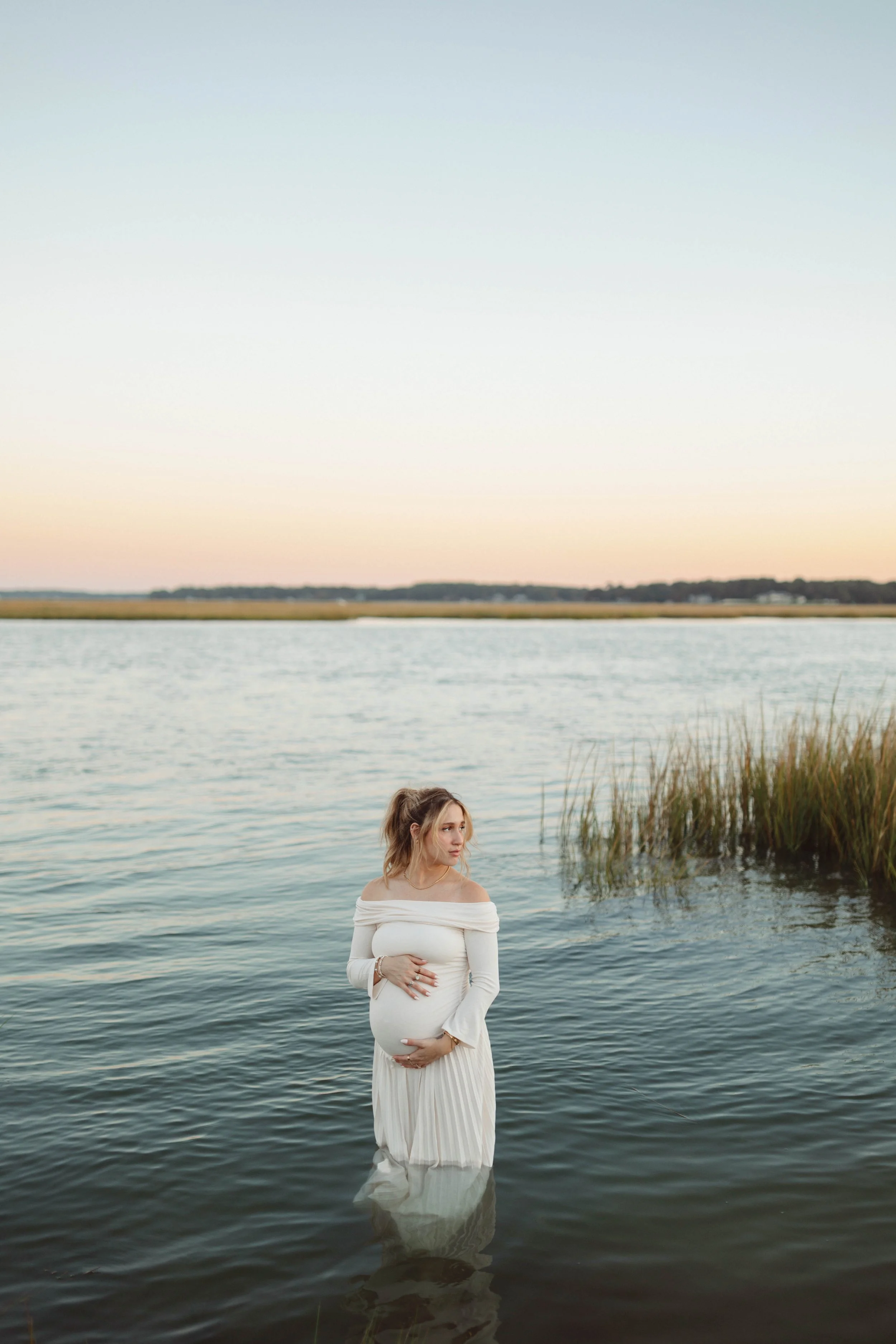 maternity session in water shoreline in Virginia Beach