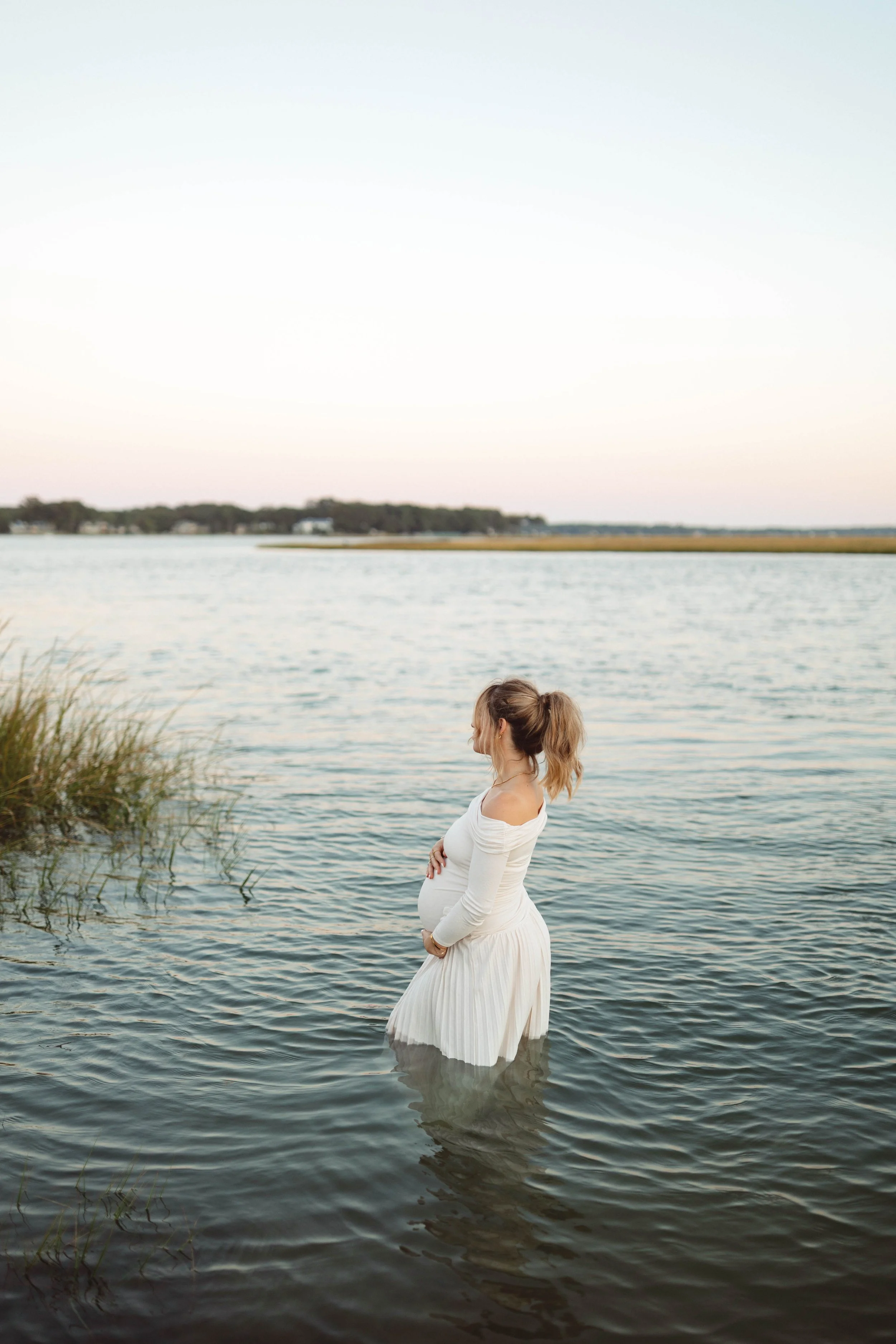 Virginia Beach photographer captures maternity photo of mom-to-be in shoreline water