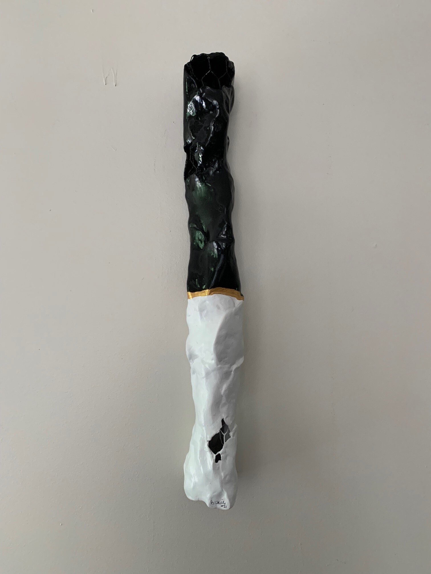 Black and White Sculpture with Gold Stripe