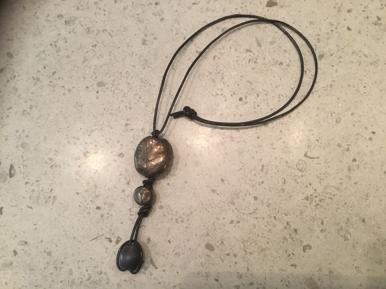 3 Bronze Ceramic beads on Brown leather