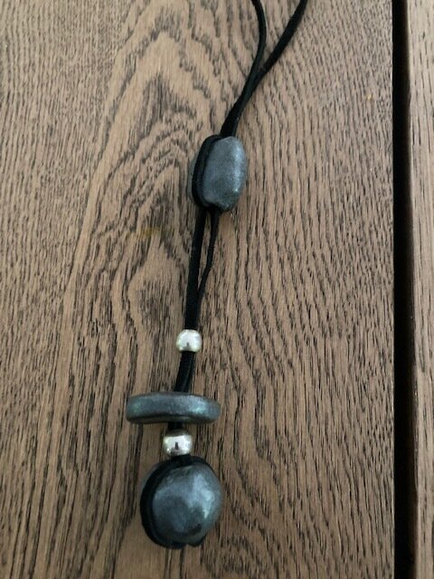 Gray Handfired Beads with Silver fittings on Black Suede