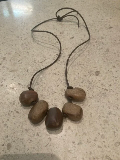 5 mini brown rock beads on brown leather.jpg