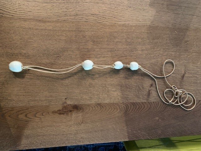 Large Round White Beads on Tan Suede