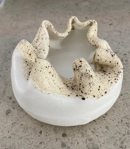 Cream white bowl with speckled rim
