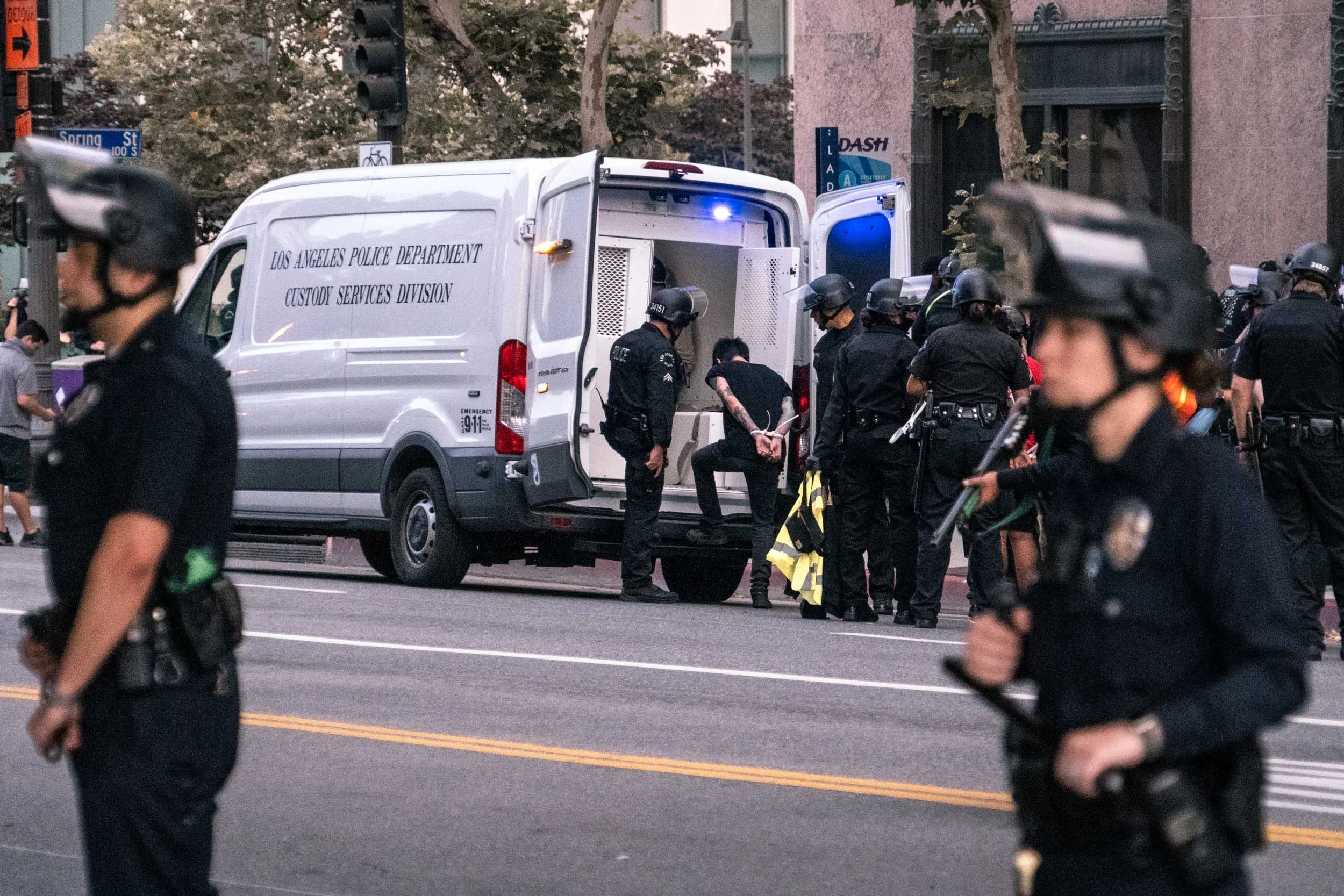  LAPD put an arrested protestor in a van in downtown Los Angeles. Around 3,000 protestors were arrested the second week in June.  June 10, 2020 