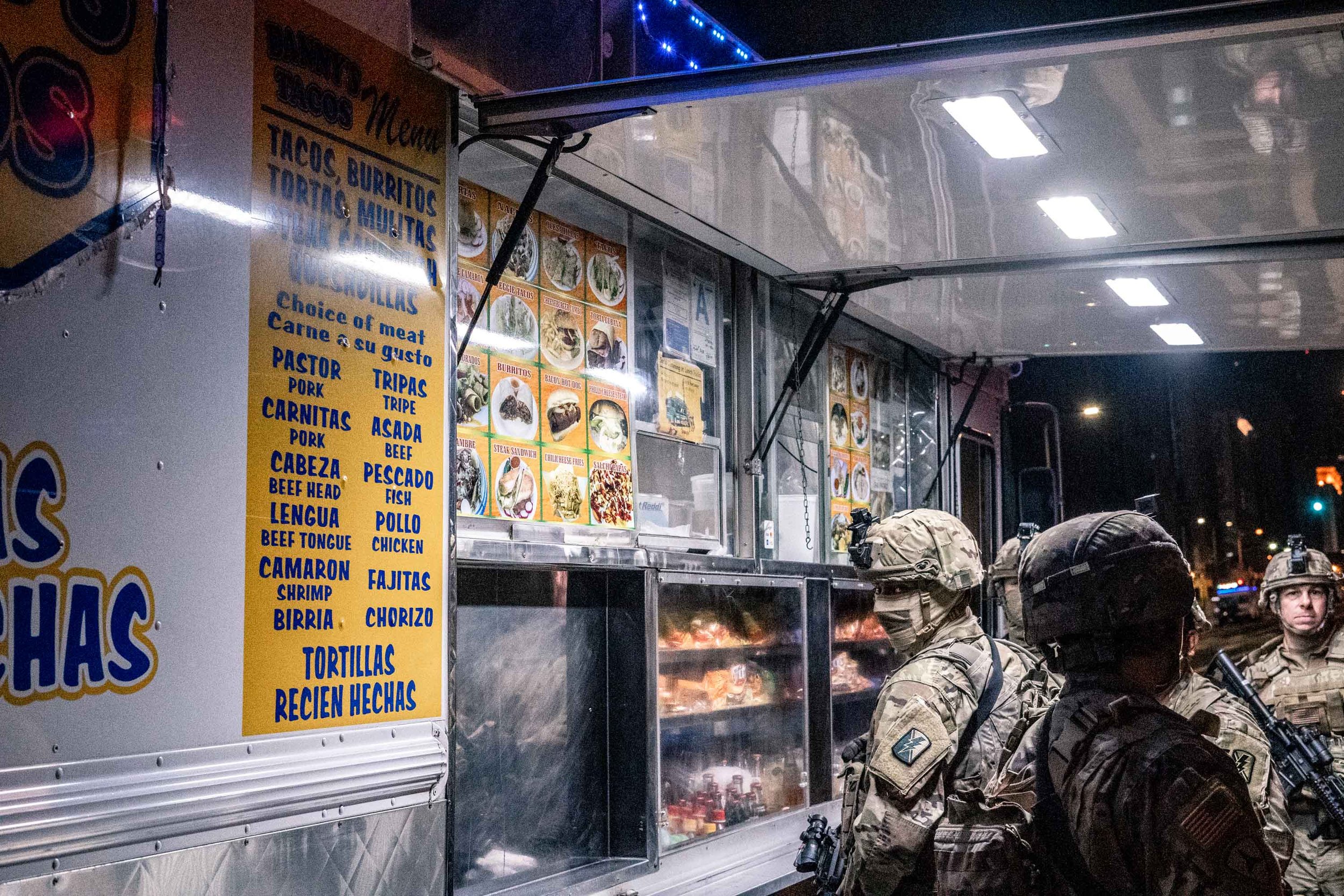  National Guardsmen order from a taco truck on 7th street in downtown Los Angeles during the George Floyd protests. June 5, 2020 