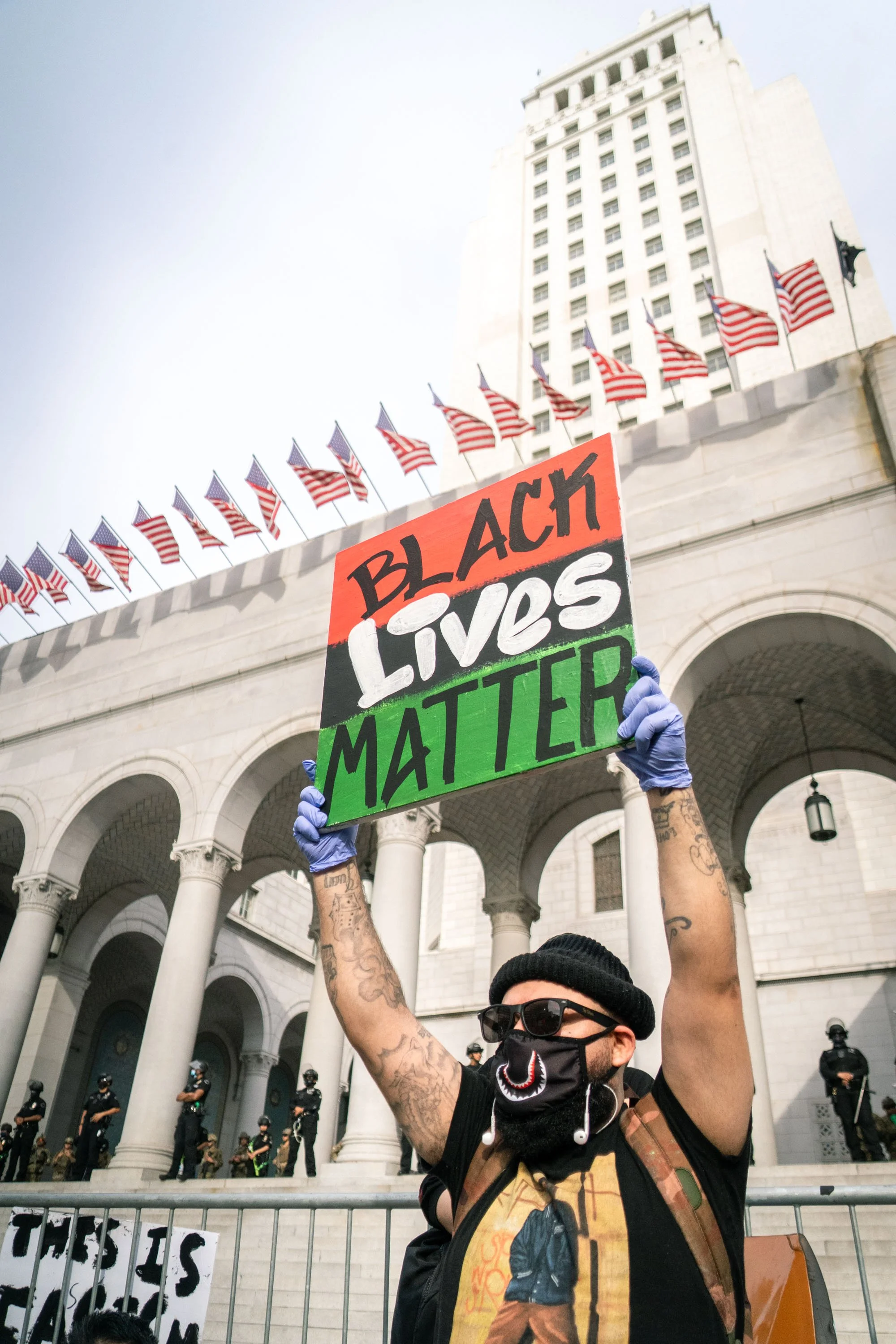  A protestor stands in front of city hall in downtown Los Angeles.  June 3, 2020  