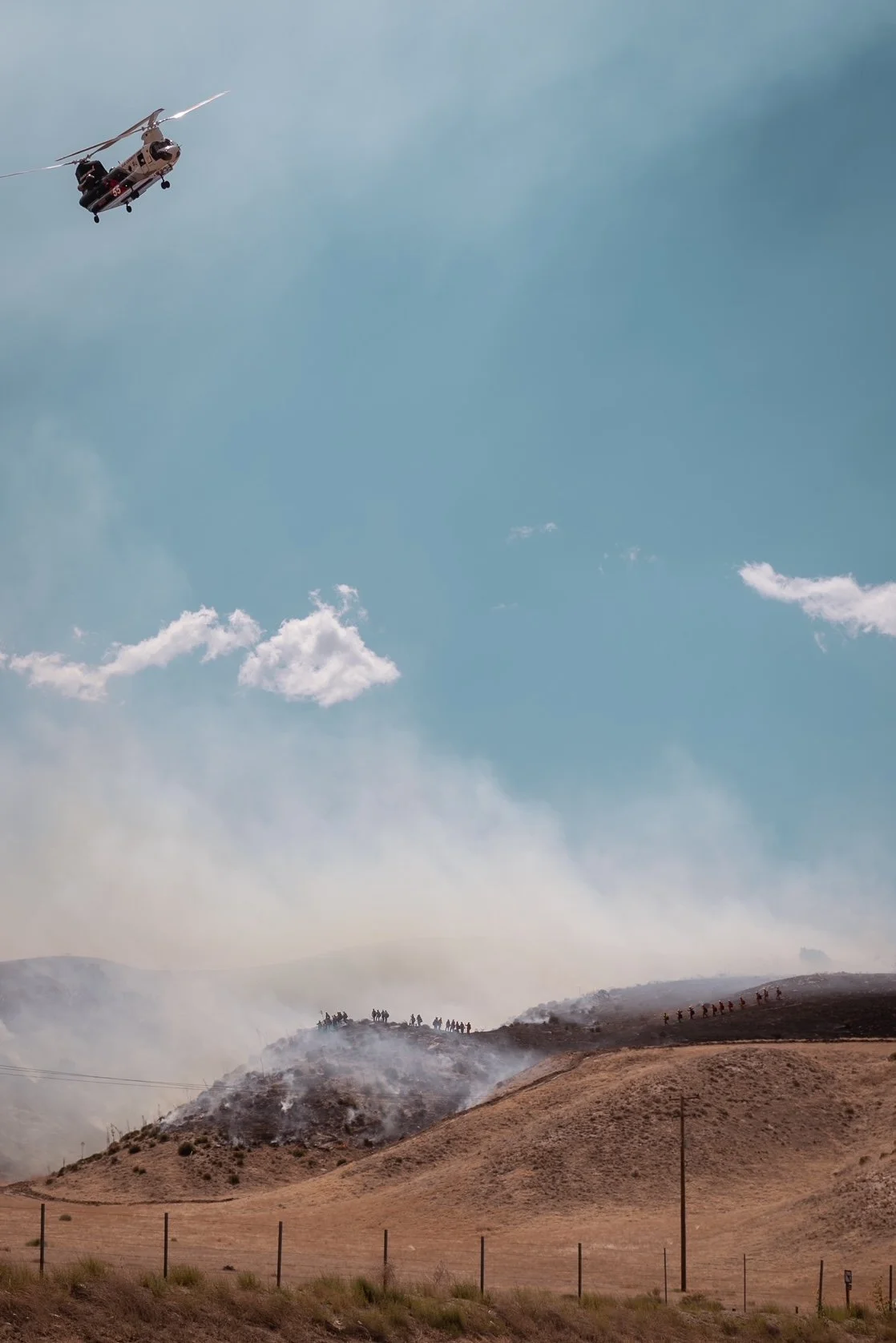  Firefighters battle a brush fire in Kern County, California. 