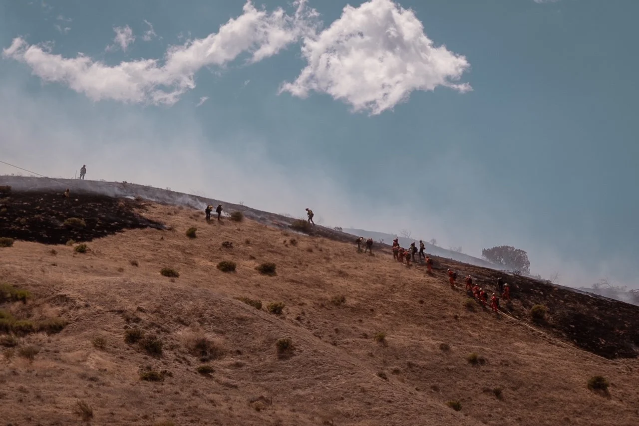  Firefighters battle a brush fire in Kern County, California. 