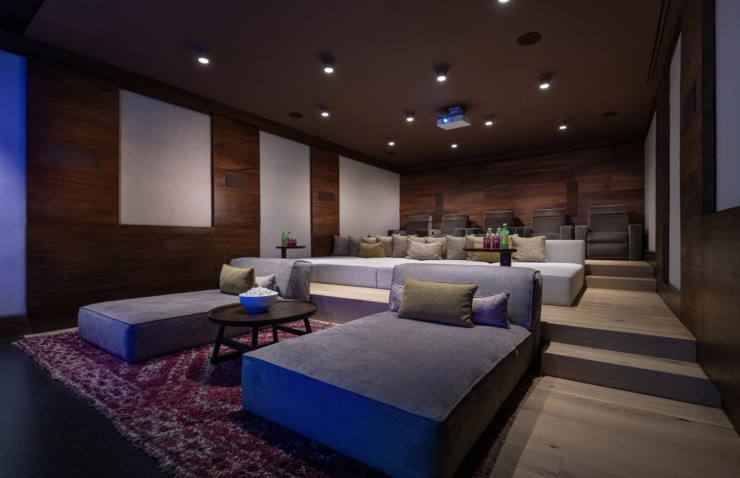 The home theater's tiered daybeds and recliner rows