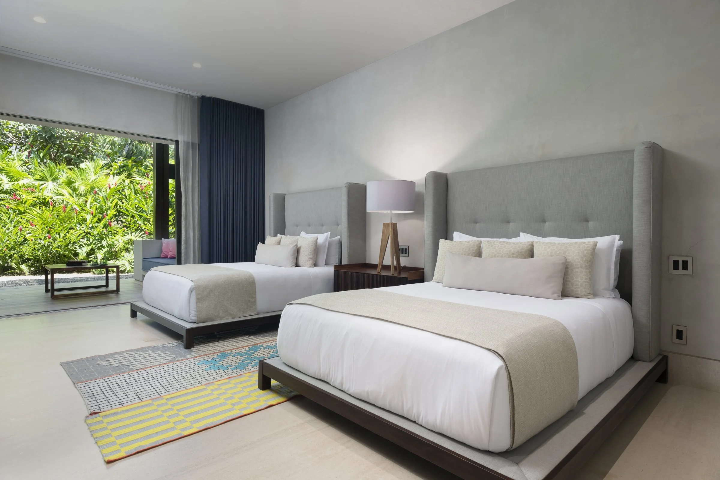A Queen room with two beds and garden terrace
